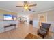 Open concept living space with hardwood floors, and an easy flow from the living area through the dining room to the kitchen at 3711 118Th W St, Bradenton, FL 34210