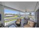 Relaxing covered patio featuring comfortable armchairs, a table and a view of the pool and backyard at 3711 118Th W St, Bradenton, FL 34210