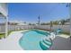 Backyard features a refreshing private pool, well-maintained landscaping and privacy fence at 3711 118Th W St, Bradenton, FL 34210