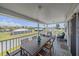 This large covered porch features outdoor seating and neighborhood views, ideal for dining or relaxing outdoors at 3711 118Th W St, Bradenton, FL 34210