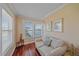 Comfortable sitting area with plush sofa, hardwood floors, and natural light from the windows at 3711 118Th W St, Bradenton, FL 34210