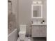 Modern bathroom featuring sleek fixtures, including a rainfall showerhead and marble countertop vanity at 3847 30Th S Ave, St Petersburg, FL 33711