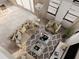 Aerial view of the bright living room with large sofa, accent chair and gray patterned rug at 3847 30Th S Ave, St Petersburg, FL 33711