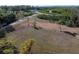 Scenic view of open land with mature trees and pathways, offering a glimpse of a tranquil natural setting at 3847 30Th S Ave, St Petersburg, FL 33711