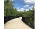 Scenic walkway surrounded by trees, ideal for a relaxing stroll at 3847 30Th S Ave, St Petersburg, FL 33711