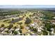 Aerial view showcases a home with pool, located on a golf course community with beautiful water features at 3859 Little Country Rd, Parrish, FL 34219