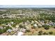 A scenic aerial view of a residential area featuring mature trees and lush landscaping at 3859 Little Country Rd, Parrish, FL 34219