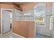 Bathroom with a glass-enclosed shower, tile accents, and great natural light at 3859 Little Country Rd, Parrish, FL 34219