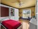 Unique guest bedroom offers built-in shelving, desk, and a Murphy bed at 3859 Little Country Rd, Parrish, FL 34219