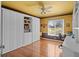 Unique guest bedroom offers built-in shelving, desk, and a Murphy bed at 3859 Little Country Rd, Parrish, FL 34219