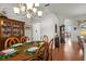 Elegant dining room with a hutch, hardwood floors, traditional furnishings, and views into adjacent living spaces at 3859 Little Country Rd, Parrish, FL 34219