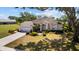 Charming single-story home with well-manicured landscaping, inviting curb appeal, and an attached two-car garage at 3859 Little Country Rd, Parrish, FL 34219