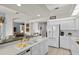 Bright kitchen featuring white cabinetry and a breakfast bar at 3859 Little Country Rd, Parrish, FL 34219