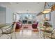 Open concept living room and dining area filled with natural light at 3859 Little Country Rd, Parrish, FL 34219