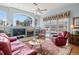 Bright living room featuring fireplace, comfortable seating, and view of the pool at 3859 Little Country Rd, Parrish, FL 34219