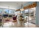 Inviting living room seamlessly opens to a dining area and pool view at 3859 Little Country Rd, Parrish, FL 34219