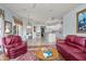 Open concept living room flows into kitchen and dining area at 3859 Little Country Rd, Parrish, FL 34219