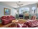 Inviting living room featuring a fireplace and a large window with exterior views at 3859 Little Country Rd, Parrish, FL 34219