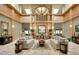 Elegant clubhouse lobby with high ceilings, wood accents, comfortable seating, and stylish decor at 3859 Little Country Rd, Parrish, FL 34219