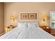 Inviting main bedroom with hardwood floors, bedside tables, and soft, natural lighting at 3859 Little Country Rd, Parrish, FL 34219