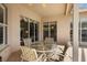 Relax in style on this outdoor patio seating area adjacent to the pool, accessed by sliding glass doors at 3859 Little Country Rd, Parrish, FL 34219