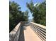 Picturesque boardwalk with white railings offering stunning waterfront views, a serene spot for relaxation and enjoyment at 3901 30Th S Ave, St Petersburg, FL 33711