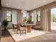 Bright dining room with modern lighting, comfortable seating, and a view of the outdoors at 3901 30Th S Ave, St Petersburg, FL 33711