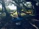 Relaxing hammocks hanging between trees, with a cozy spot for a dog on a blue blanket at 3901 30Th S Ave, St Petersburg, FL 33711