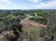 Overhead view of a land parcel surrounded by mature trees and a waterway in the distance at 3901 30Th S Ave, St Petersburg, FL 33711