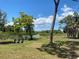 Inviting park bench nestled in a lush green space near the water at 3901 30Th S Ave, St Petersburg, FL 33711