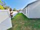 This backyard has a green grass lawn, privacy fence, and side yard at 4501 20Th S Ave, St Petersburg, FL 33711