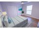 Bedroom featuring decorations, closet, new window, and attractive wood-look floors at 4501 20Th S Ave, St Petersburg, FL 33711