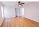 Bedroom with ensuite bathroom, new windows, modern ceiling fan, and attractive wood-look floors at 4501 20Th S Ave, St Petersburg, FL 33711
