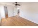 Spacious bedroom with hardwood floors and a view to the kitchen and a walk-in closet, blending style and functionality at 4501 20Th S Ave, St Petersburg, FL 33711