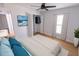 Cozy staged bedroom boasts light wood floors, modern decor, and a relaxing atmosphere at 4501 20Th S Ave, St Petersburg, FL 33711