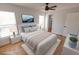 This bedroom features wood floors, a ceiling fan, and a large TV on the wall at 4501 20Th S Ave, St Petersburg, FL 33711