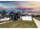 Charming home with a well-manicured lawn, landscaped front yard, and white fence at 4501 20Th S Ave, St Petersburg, FL 33711