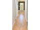 Hallway leads to the front door with wood-look flooring and white trim at 4501 20Th S Ave, St Petersburg, FL 33711