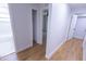 Hallway shows access to the bathroom and bedroom with wood look flooring at 4501 20Th S Ave, St Petersburg, FL 33711