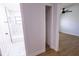Hallway with bathroom on one side and bedroom on the other; wood look flooring at 4501 20Th S Ave, St Petersburg, FL 33711