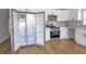 Open kitchen showcasing a stainless steel refrigerator, microwave, oven, and bright countertops at 4501 20Th S Ave, St Petersburg, FL 33711