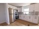 Bright kitchen featuring white cabinets, stainless steel appliances, and subway tile backsplash, creating a clean, modern aesthetic at 4501 20Th S Ave, St Petersburg, FL 33711