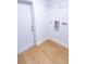 Laundry room with wood look floors, white walls, and utility connections at 4501 20Th S Ave, St Petersburg, FL 33711