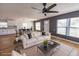 Staged living room features new wood flooring and open plan layout to kitchen and dining areas at 4501 20Th S Ave, St Petersburg, FL 33711