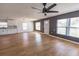 Spacious living room with wood floors, modern ceiling fan, and ample natural light at 4501 20Th S Ave, St Petersburg, FL 33711