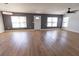 Spacious living room featuring modern light fixture, new windows, and attractive wood-look floors at 4501 20Th S Ave, St Petersburg, FL 33711