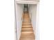 Wooden staircase with white walls and wood look floors leading to the upper level at 4501 20Th S Ave, St Petersburg, FL 33711