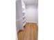 Walk-in closet offers ample storage space with shelving and laminate wood flooring at 4501 20Th S Ave, St Petersburg, FL 33711