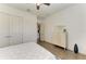 Bedroom with white walls, wood floors, a chest, and access to other parts of the house at 4607 Benito Ct, Bradenton, FL 34211