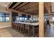 Spacious community bar area with ample seating, stylish design, and multiple TVs for entertainment and social gatherings at 4607 Benito Ct, Bradenton, FL 34211